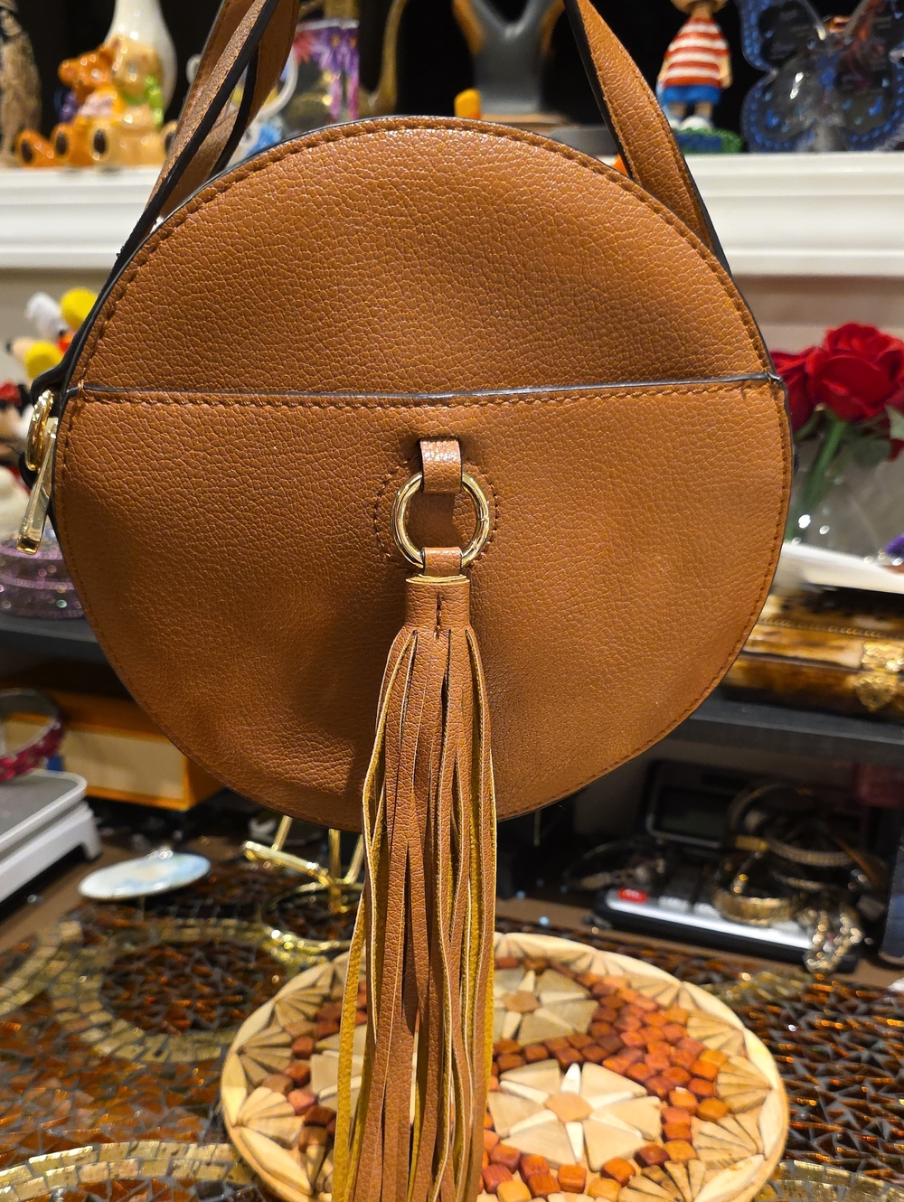 Charming Charlie Round Tan Crossbody with Tassel